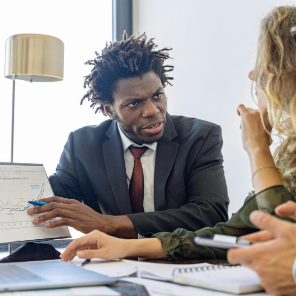 A business development consultant talking to his teammates