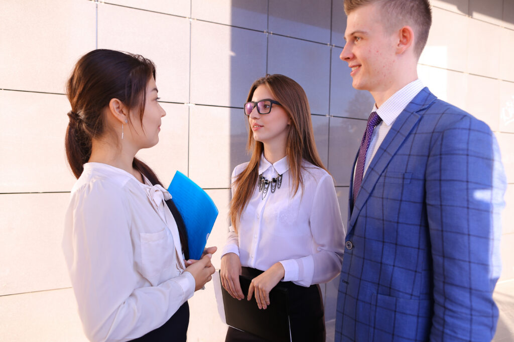 Summer sales interns talking to each other
