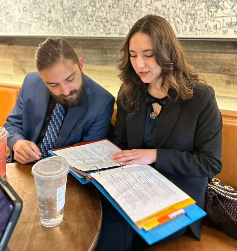 Zenith Innovations team members reviewing documents together